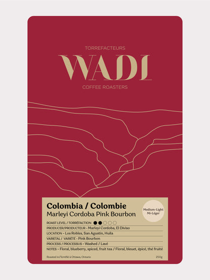 Colombia Marleyi Córdoba Pink Bourbon coffee beans from Wadi Coffee Roasters in a bag with colorful label and branding.