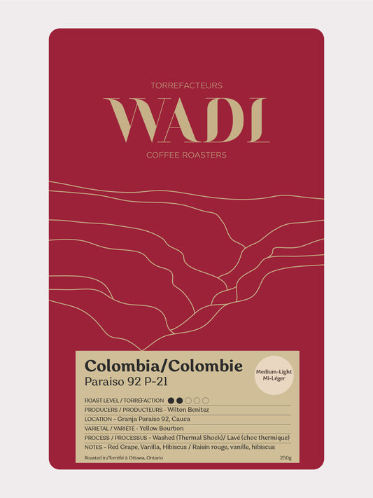Colombia Paraíso 92 Yellow Bourbon coffee beans from Wadi Coffee Roasters, shown in a close-up image of roasted beans.